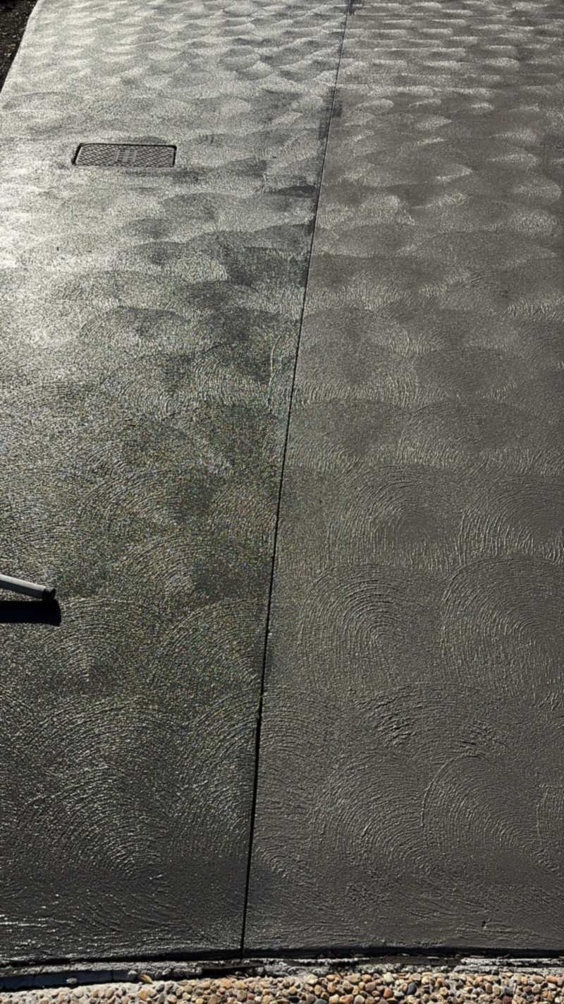 Close-up of a driveway coating with a hand-applied swirl texture
